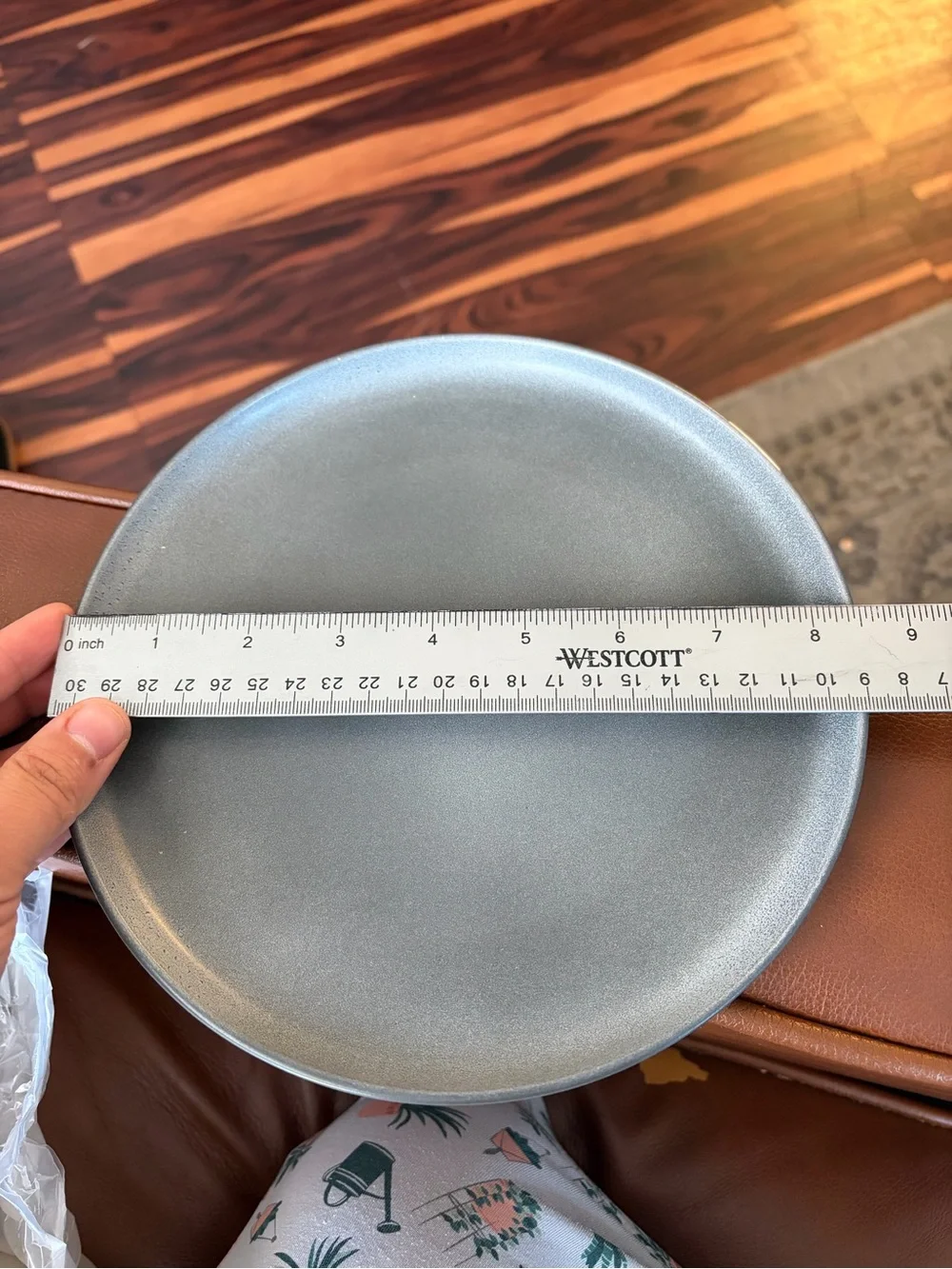 Crate&Barrel Matte Gray Stoneware Charger with Natural Rim and White candle